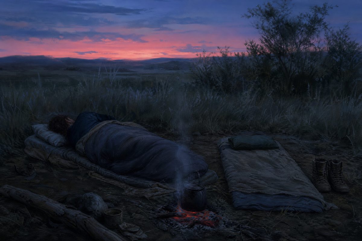 An empty campsite at blue hour with one occupied bedroll and one laid out unused beside it